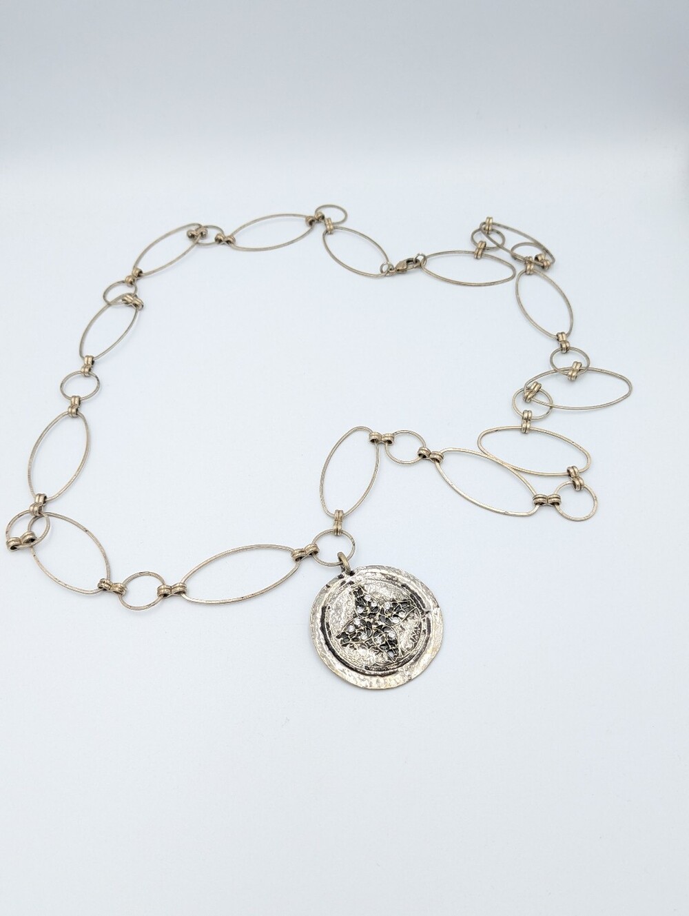 5/25$   Long silver tone statement pendant necklace